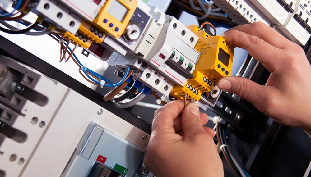 a picture of a hand touching a low voltage wiring system